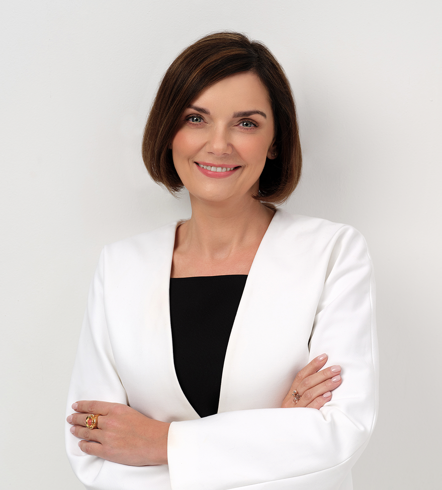 Woman smiling in white blazer